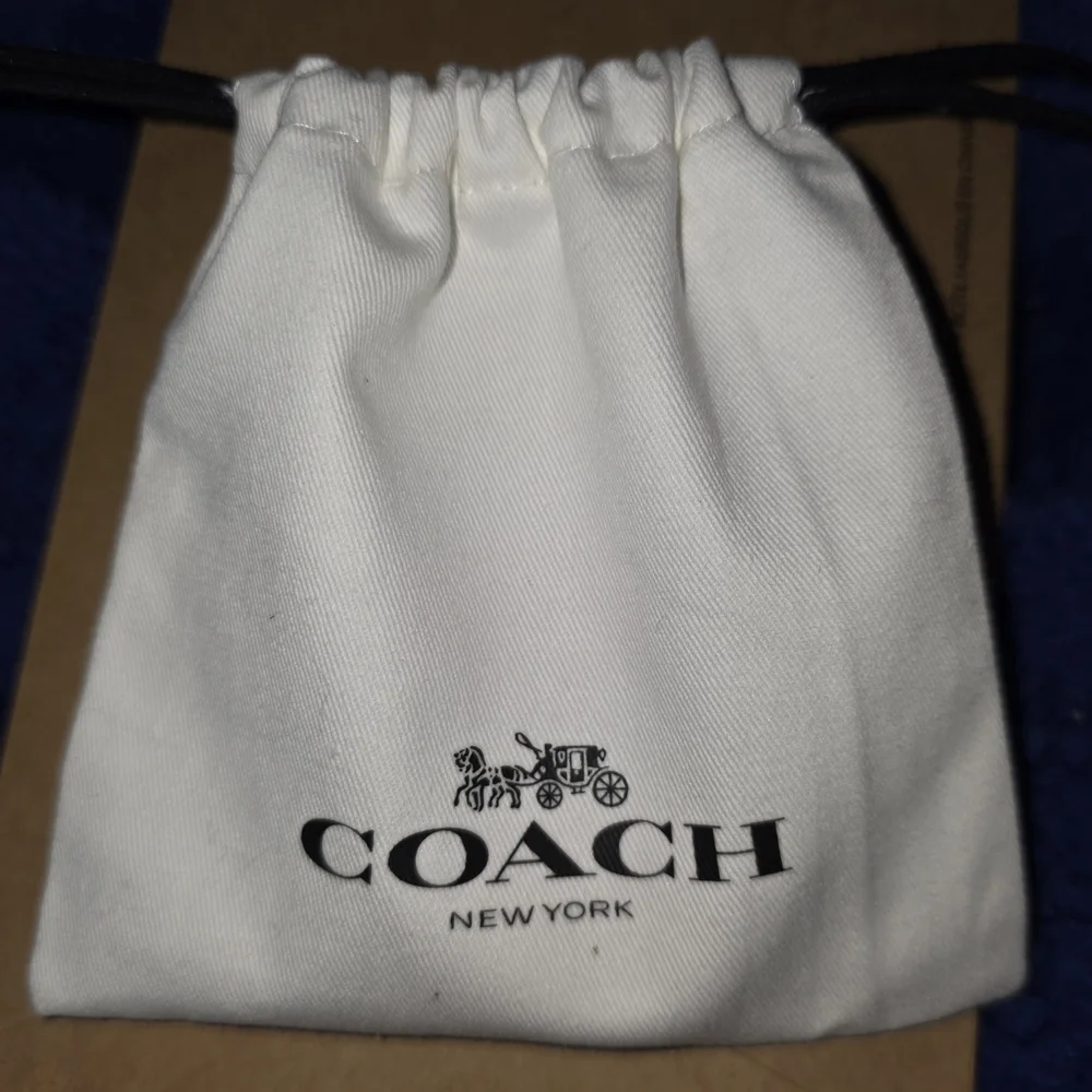 COACH Silver And Orange Daisy Pendant Necklace - Picture 6 of 6